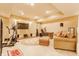 Finished basement with an exercise area and entertainment space that includes a flat screen television and sofa at 626 N Senate Ave, Indianapolis, IN 46202