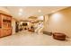 Finished basement with access to upper floors via carpeted staircase, tiled floors and seating area at 626 N Senate Ave, Indianapolis, IN 46202