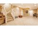 Finished basement features a carpeted staircase, tiled floors, neutral paint scheme and access to other areas at 626 N Senate Ave, Indianapolis, IN 46202