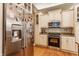 Modern kitchen with stainless steel appliances, granite counters, and ample storage cabinets at 626 N Senate Ave, Indianapolis, IN 46202