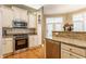 Modern kitchen featuring stainless steel appliances, granite counters, and an eat-in bar at 626 N Senate Ave, Indianapolis, IN 46202
