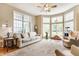 Bright living room with large windows, comfortable seating, and neutral decor at 626 N Senate Ave, Indianapolis, IN 46202