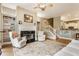 Bright living room with large windows, fireplace, and comfortable seating near the staircase at 626 N Senate Ave, Indianapolis, IN 46202