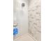 Close-up of shower featuring modern marble tile and chrome fixtures at 626 N Senate Ave, Indianapolis, IN 46202