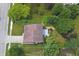 Aerial view of a property outlined in a property line featuring a home with a deck and mature landscaping at 6549 Wilshire Pl, Zionsville, IN 46077