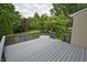 Open view from a back deck offering a tranquil view of the private backyard filled with lush greenery and trees at 6549 Wilshire Pl, Zionsville, IN 46077