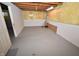 Unfinished basement with painted floors, insulated walls, and exposed ceiling at 6549 Wilshire Pl, Zionsville, IN 46077
