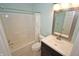 Bathroom with vanity and mirror, tile floors, shower, and toilet at 6549 Wilshire Pl, Zionsville, IN 46077
