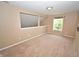 Comfortable bedroom featuring neutral carpeting and a view of the staircase at 6549 Wilshire Pl, Zionsville, IN 46077