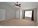 Vaulted bedroom features neutral carpets and a ceiling fan at 6549 Wilshire Pl, Zionsville, IN 46077