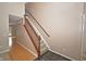 Welcoming entryway features hardwood floors and a staircase leading to the upper level at 6549 Wilshire Pl, Zionsville, IN 46077