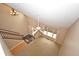 A high-angle view of the living room showcasing the staircase and windows at 6549 Wilshire Pl, Zionsville, IN 46077