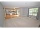 Open-concept living room seamlessly flows into a modern kitchen, perfect for entertaining at 6549 Wilshire Pl, Zionsville, IN 46077