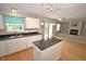 Bright, open concept eat-in kitchen and living space with fireplace, lots of light, and hardwood floors at 6549 Wilshire Pl, Zionsville, IN 46077