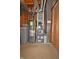 Utility room featuring a water heater, water softener and furnace at 6549 Wilshire Pl, Zionsville, IN 46077