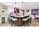 Finished basement bar with granite counters, bar stools, and decorative lighting at 6672 Braemar S Ave, Noblesville, IN 46062