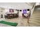 Finished basement with bar, rec area, and staircase to the upper level at 6672 Braemar S Ave, Noblesville, IN 46062