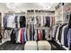 Large walk-in closet with ample shelving and storage, plus stylish ottomans at 6672 Braemar S Ave, Noblesville, IN 46062
