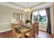 Elegant dining room with natural light, chandelier, hardwood floors, and seating for six at 6672 Braemar S Ave, Noblesville, IN 46062