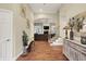 Welcoming foyer features hardwood floors and an archway leading to the living room at 6672 Braemar S Ave, Noblesville, IN 46062