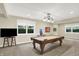 Basement game room featuring a classic pool table, recessed lighting, and windows for natural light makes a great recreation space at 6672 Braemar S Ave, Noblesville, IN 46062