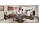 Open living room area with comfortable seating, stylish decor, and carpet floors offer a welcoming atmosphere at 6672 Braemar S Ave, Noblesville, IN 46062