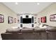 Cozy living room featuring comfortable seating, custom built-ins, and wall decor provides a relaxing space for gathering at 6672 Braemar S Ave, Noblesville, IN 46062