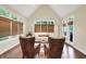 Bright living room with vaulted ceiling, large windows, and elegant seating arrangement at 6672 Braemar S Ave, Noblesville, IN 46062