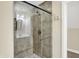 Bathroom shower with glass door and neutral-toned tile at 6672 Braemar S Ave, Noblesville, IN 46062