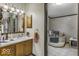Well-lit bathroom with tub and stylish vanity provides a spa-like experience at 6691 S County Road 350 W, Clayton, IN 46118