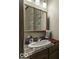Bathroom vanity with granite counters and framed mirror offer a touch of style at 6691 S County Road 350 W, Clayton, IN 46118