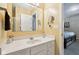 Bathroom featuring white vanity, mirror, and neutral walls at 6711 Bridgefield Way, Indianapolis, IN 46254