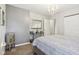 Cozy bedroom featuring a stylish mirror and furniture with elegant decorations and decor at 6711 Bridgefield Way, Indianapolis, IN 46254