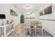 Cozy dining area with table set for four, flowing into the modern kitchen at 6711 Bridgefield Way, Indianapolis, IN 46254