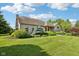 Charming brick home with a well-manicured lawn and mature landscaping at 6711 Bridgefield Way, Indianapolis, IN 46254