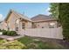 Inviting home with a decorative front yard, partial fence, and charming curb appeal at 6711 Bridgefield Way, Indianapolis, IN 46254