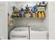 Organized laundry room with shelving and modern washer and dryer at 6711 Bridgefield Way, Indianapolis, IN 46254