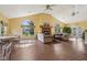 Spacious living room with vaulted ceilings, a fireplace, and lots of natural light at 6711 Bridgefield Way, Indianapolis, IN 46254