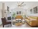 Open living room boasting vaulted ceilings, a fireplace, and modern decor at 6711 Bridgefield Way, Indianapolis, IN 46254