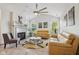 Inviting living room with fireplace, vaulted ceilings, and a stylish ceiling fan at 6711 Bridgefield Way, Indianapolis, IN 46254