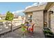 Cozy patio area featuring a colorful table set and brick siding at 6711 Bridgefield Way, Indianapolis, IN 46254
