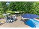 Aerial view of an outdoor patio featuring a pool, dining, and lounge area for entertaining at 7016 Royal Oakland Way, Indianapolis, IN 46236