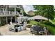Outdoor patio features comfortable seating and a pergola swing, perfect for relaxation and entertaining at 7016 Royal Oakland Way, Indianapolis, IN 46236