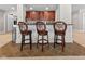 The basement features a stylish bar with comfortable seating and ample storage at 7016 Royal Oakland Way, Indianapolis, IN 46236