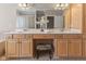 Bright bathroom features double vanity, large mirror, modern fixtures, and a glass block shower at 7016 Royal Oakland Way, Indianapolis, IN 46236