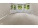 Bright bedroom with multiple windows, neutral walls, and plush carpeting at 7016 Royal Oakland Way, Indianapolis, IN 46236