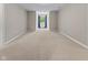 Expansive bedroom showcasing a light-filled space with plush carpeting and a tranquil ambiance at 7016 Royal Oakland Way, Indianapolis, IN 46236