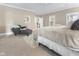 Relaxing bedroom with a sitting area, carpet, and closet at 7016 Royal Oakland Way, Indianapolis, IN 46236