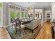 Dining room with table and chairs, large windows, and colorful rug at 7016 Royal Oakland Way, Indianapolis, IN 46236