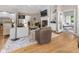 Spacious living room with hardwood floors, fireplace, built-ins, and open layout at 7016 Royal Oakland Way, Indianapolis, IN 46236